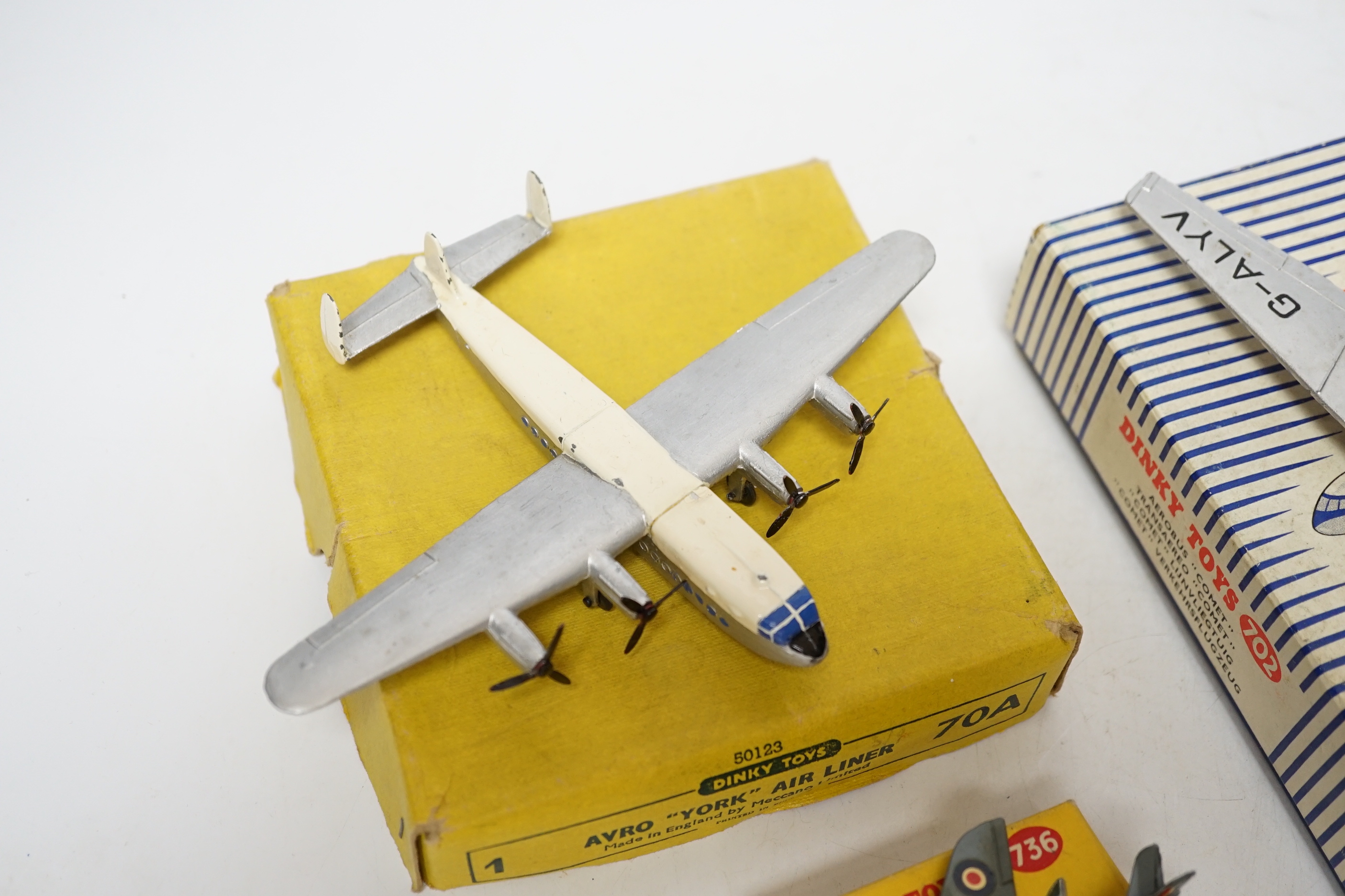 Four Dinky Toys aircraft; three boxed examples including (702) DH Comet Airliner, (70A) Avro York Airliner, (736) Hawker Hunter Fighter, and an unboxed Twin Engined Fighter